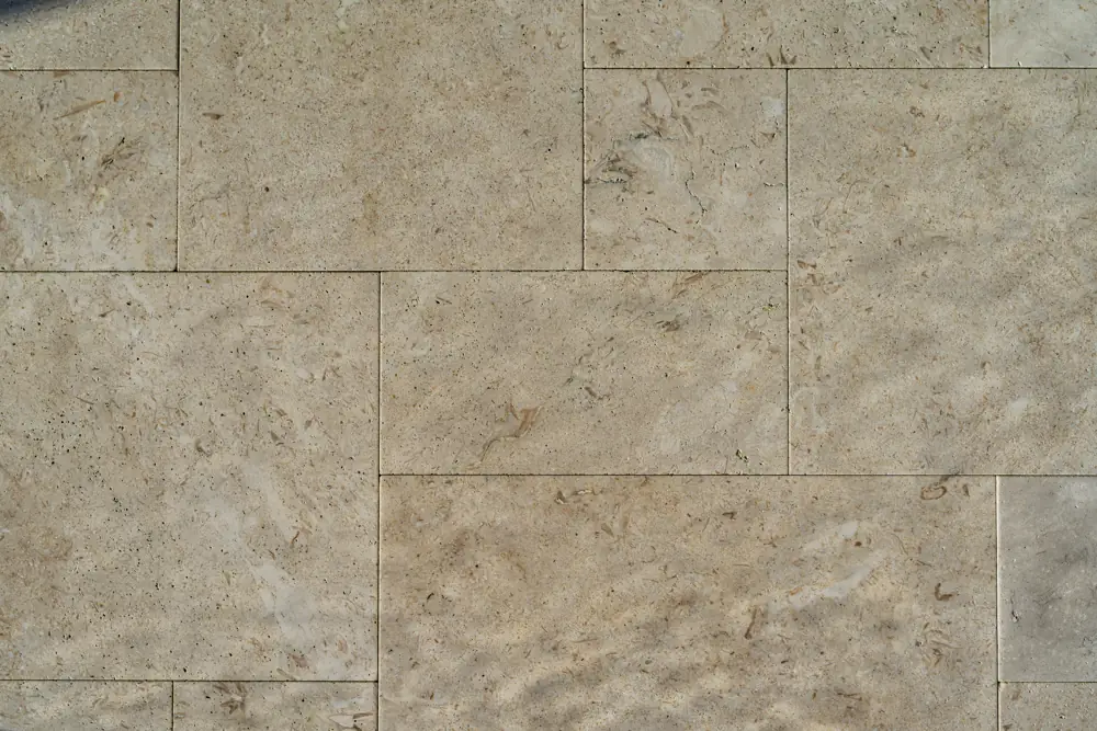 Travertine pavers in a French pattern